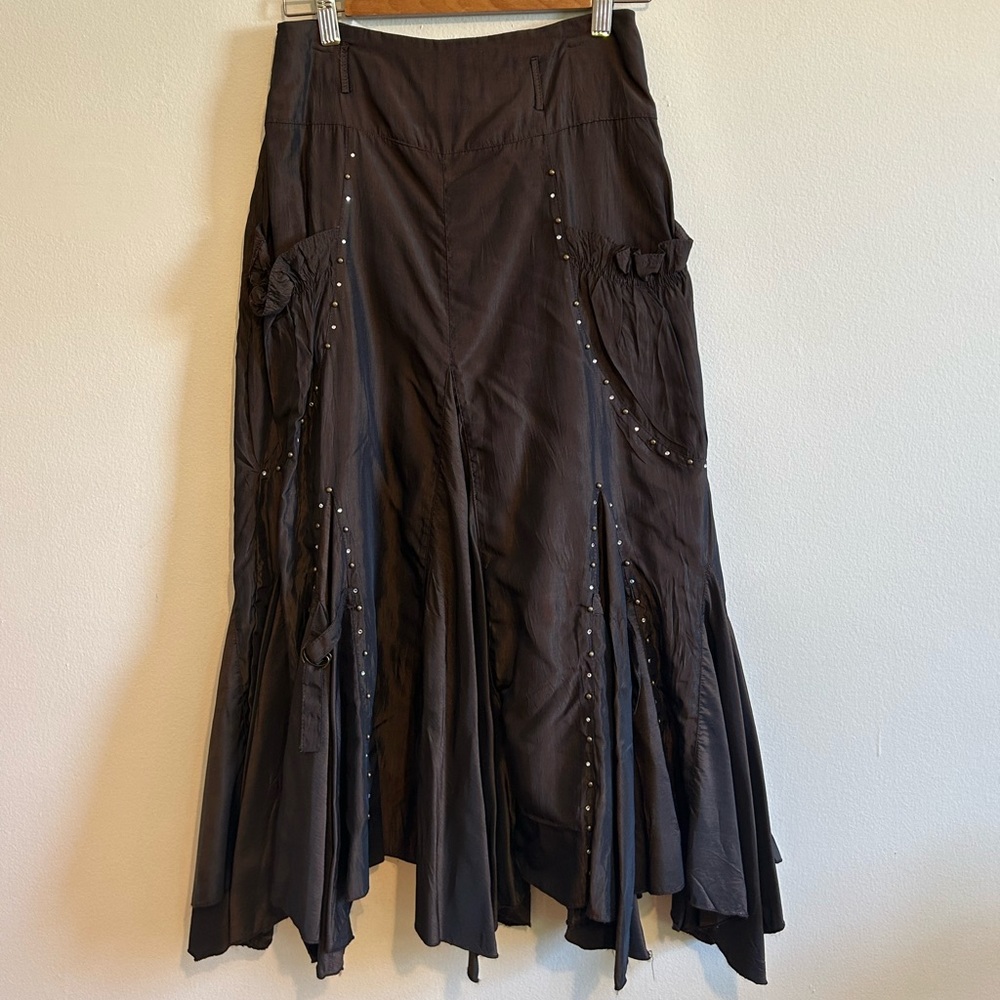 Shiny brown skirt with flares, pockets and rhinestone detail